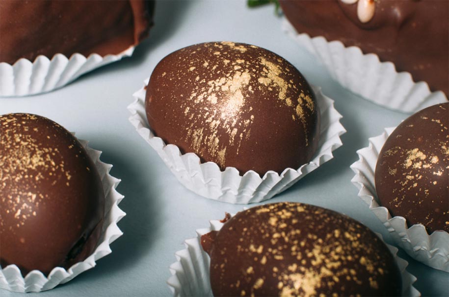 A tray of chocolate covered eggs.