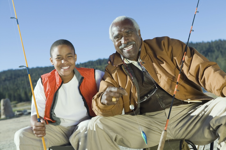 Smiling Grandfather and Grandson Fishing