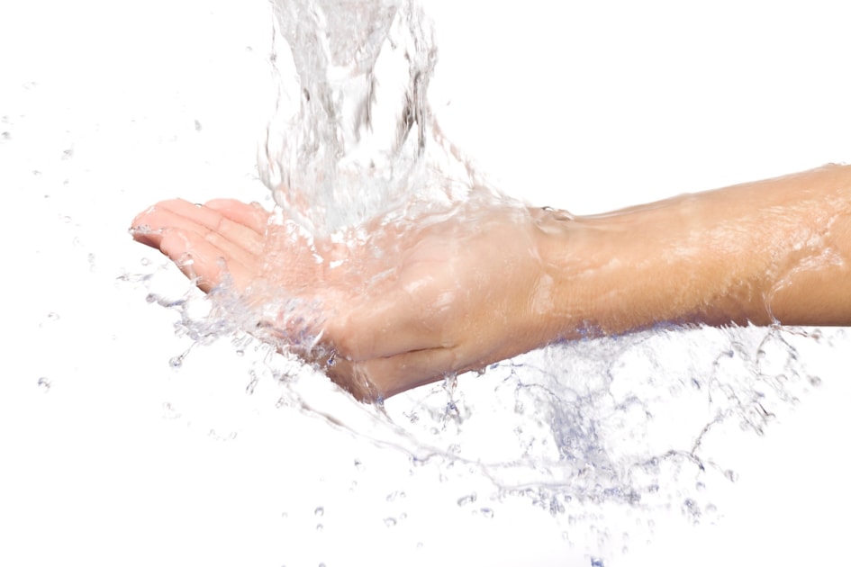 Water on hands with white background.