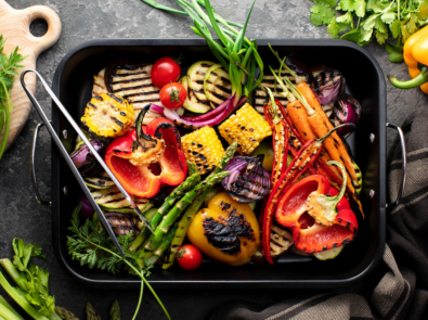 Freshly grilled vegetables in a grilling sheet pan, overhead view