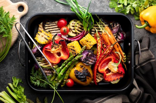Freshly grilled vegetables in a grilling sheet pan, overhead view