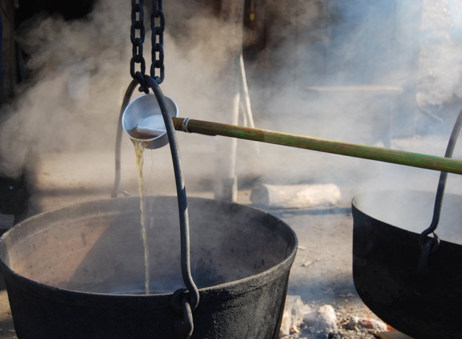 Boiling maple syrup outside.