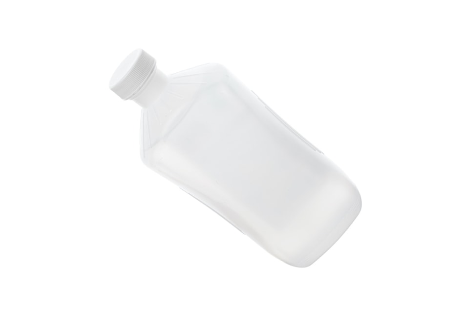 bottle of rubbing alcohol on white background