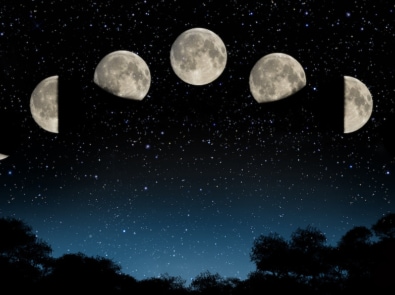 Moon phases across night sky.