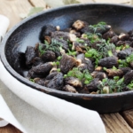 Morels mushrooms fried in a pan.
