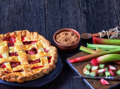 Homemade Strawberry Rhubarb Pie on a table.