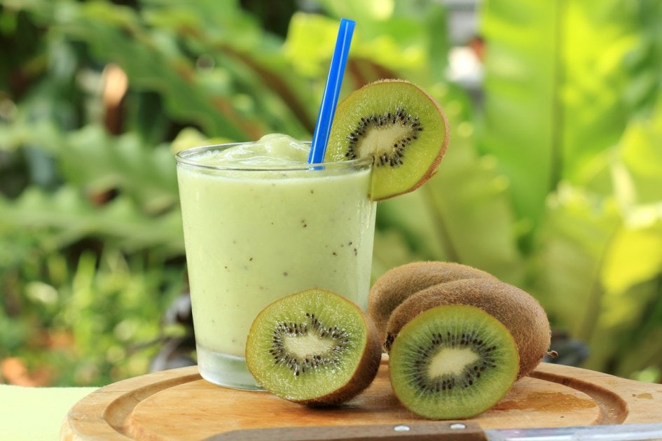 Kiwi smoothie on cutting board.