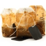 Used tea bags with label on white