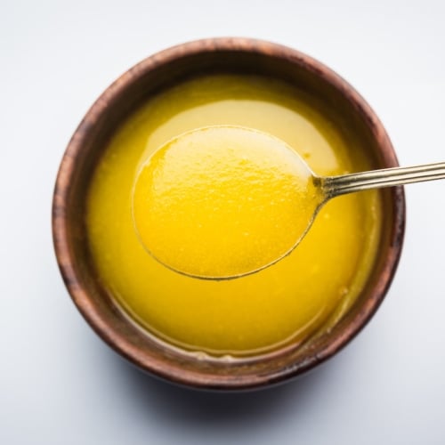 Overhead view of ghee in bowl.