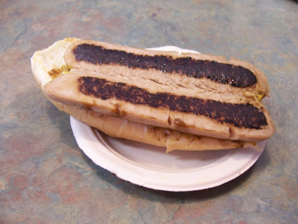 white hot dog grilled on a bun.