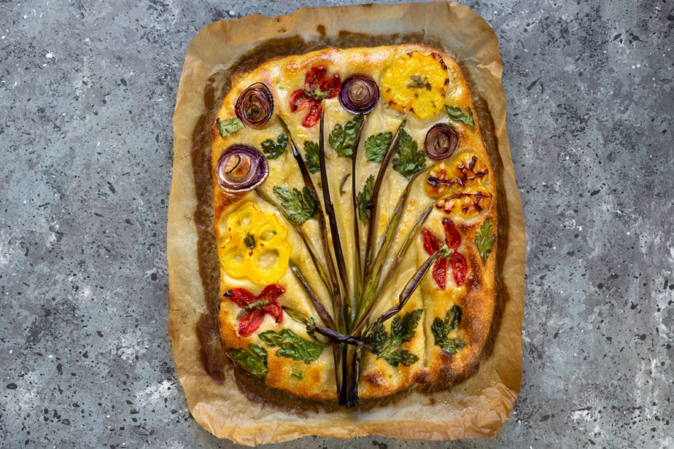 Flower focaccia Creative idea of focaccia cooking. Crispy focaccia with vegetables. Healthy food concept.