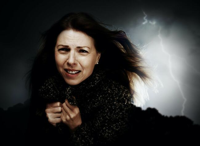 A scared woman with a weather phobia.