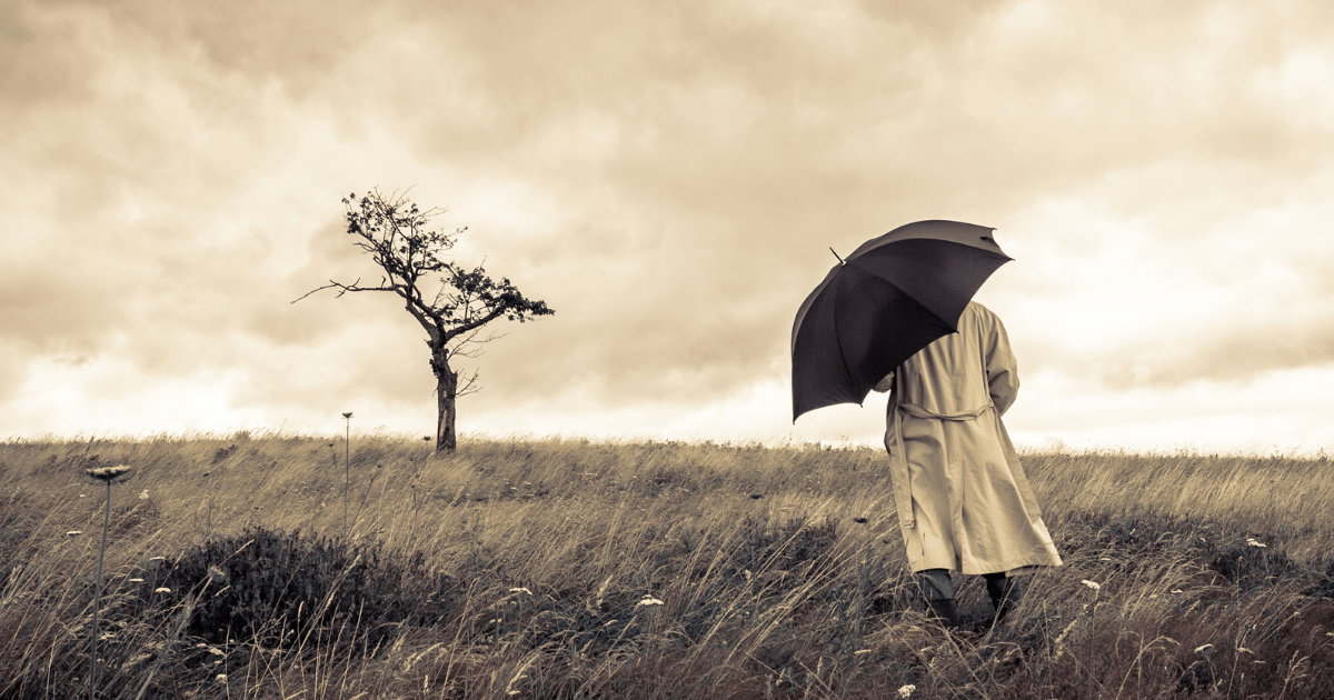 man walking with umbrella