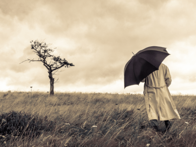 man walking with umbrella