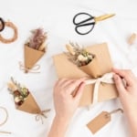 Gift boxes in craft paper and natural decorations, creative and recyclable holidays present wrapping.