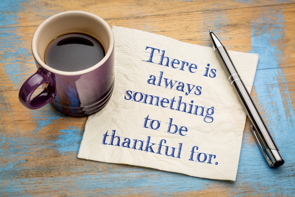 There is always something to be thankful for. - handwriting on a napkin with a cup of espresso coffee