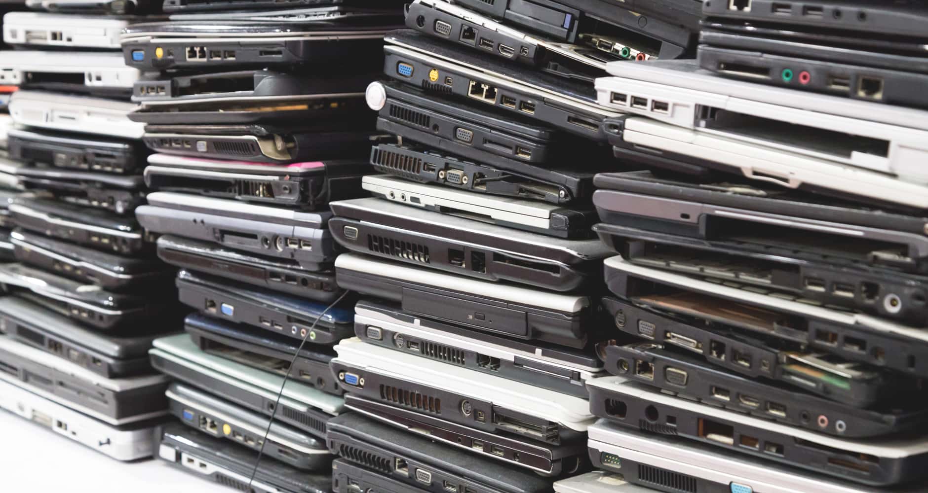 recycle electronics - stacks of laptops