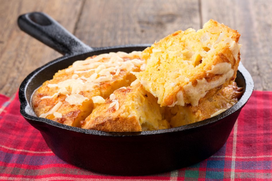 Freshly baked corn bread in cast iron pan.