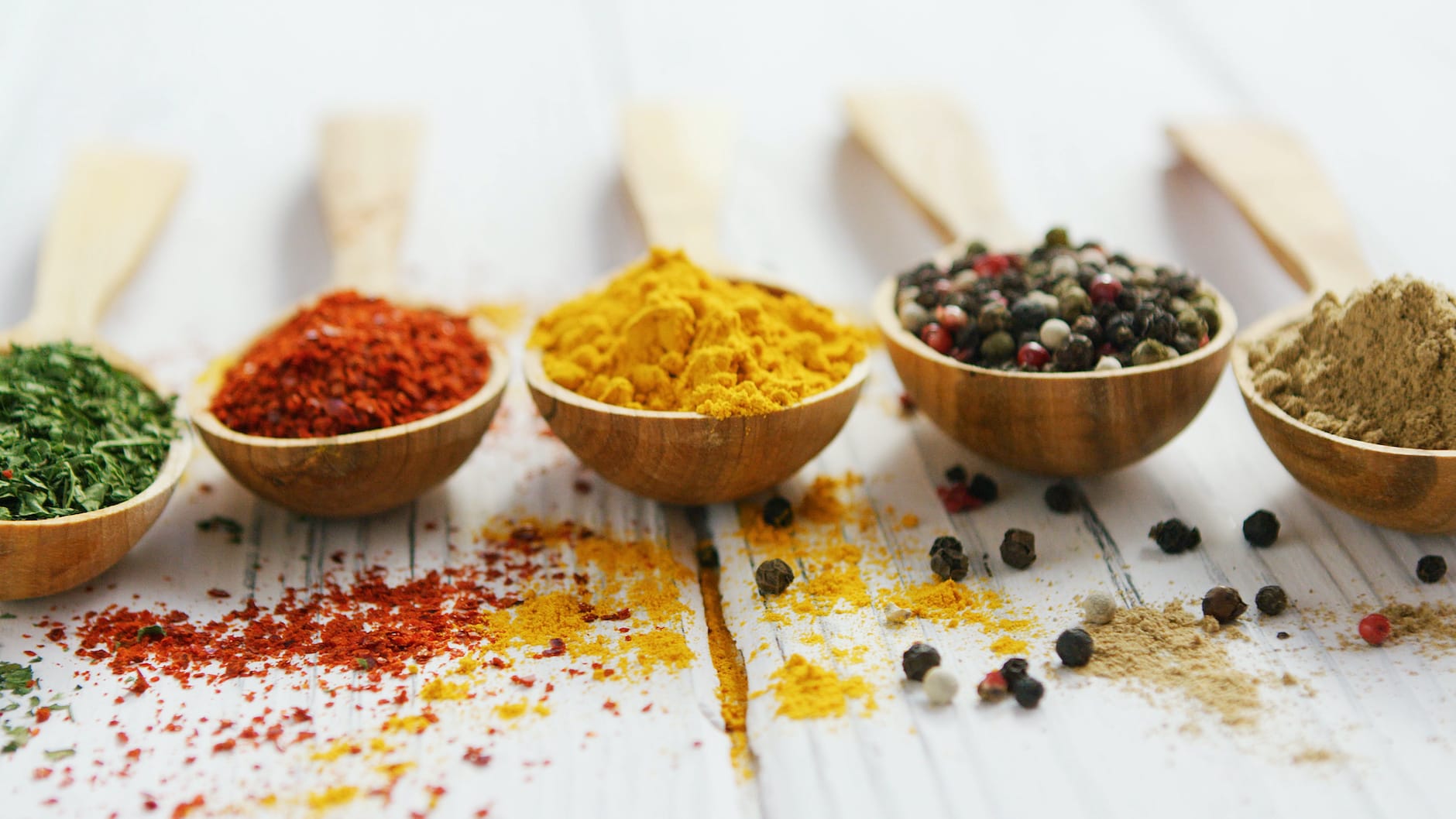 array of colorful spices in bowls