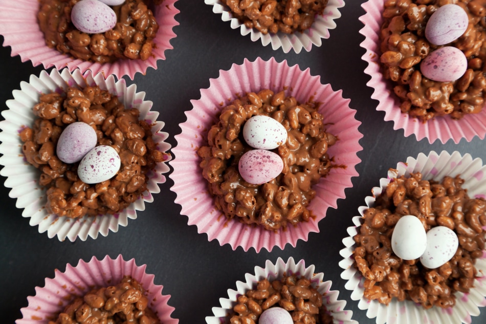 Close up of rice crispie cakes in pink and white cup cake cases.