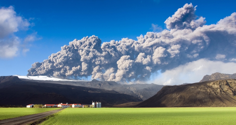 Eruption of the Eyjafjallajökull volcano with a large plume of ash clouds. Climate concept.