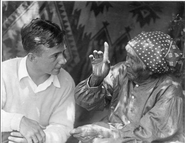 Black and white photo of George Melendez Wright and Totuya talking.