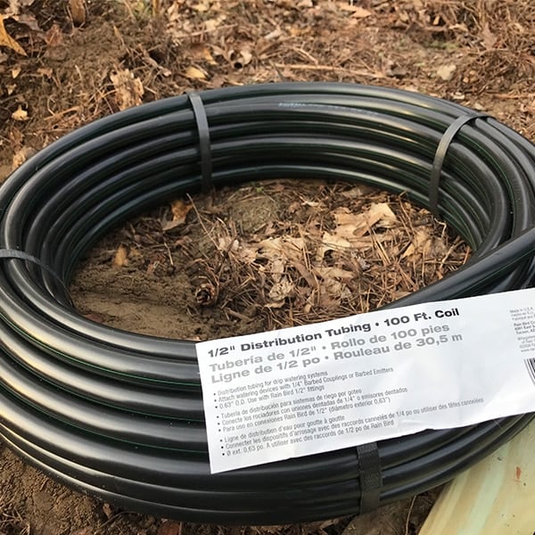 black irrigation tubing with label