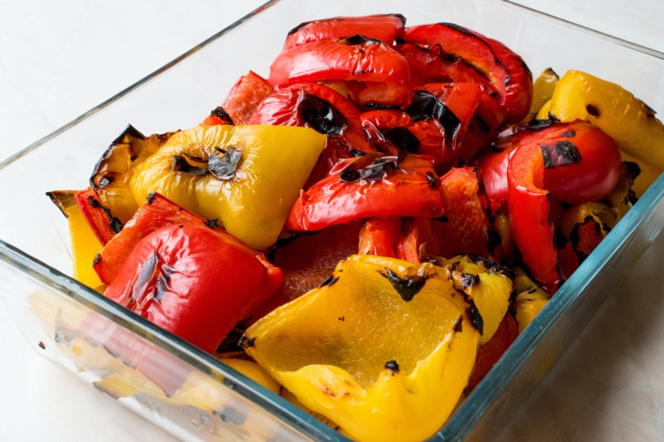 Grilled peppers in a glass dish.
