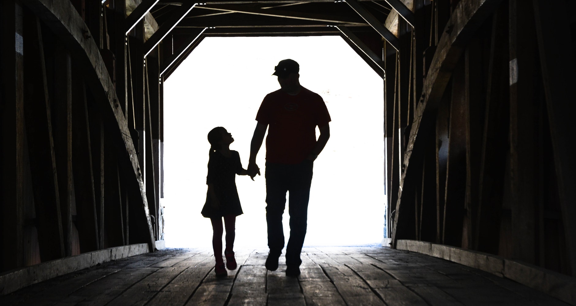 memories of their fathers - young daughter and father walking out of a barn