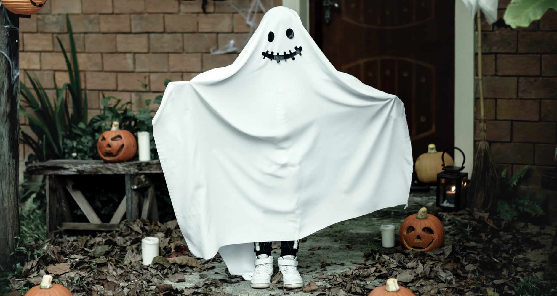 Halloween weather forecast - image of a ghost decoration next to a house