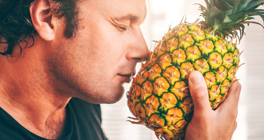 Smell the bottom of a pineapple to tell if it is ripe.