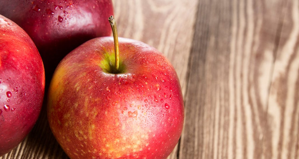 delicious looking apples with water drops