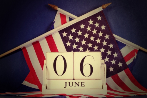 Retro vintage style D-Day calendar against a dark blue grunge background with USA stars and stripes and British UK Union Jack flags.
