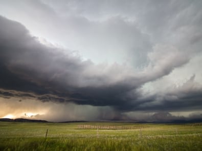 A supercell storm drops large amounts of rain and hail over the high plains of Wyoming in the evening.