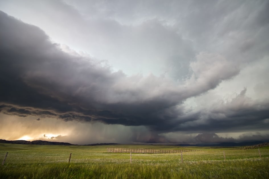 A supercell storm drops large amounts of rain and hail over the high plains of Wyoming in the evening.