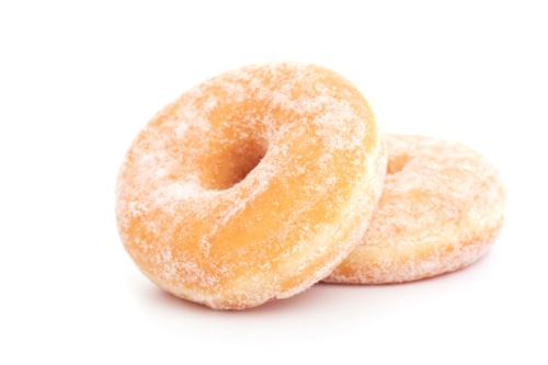 Two powered donuts against a white background.