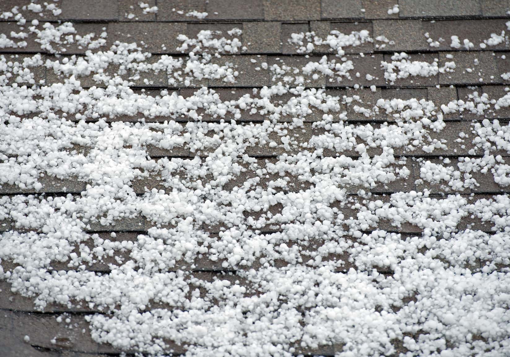 Hail on the Roof. After Heavy Storm with Hail. Roof Closeup.