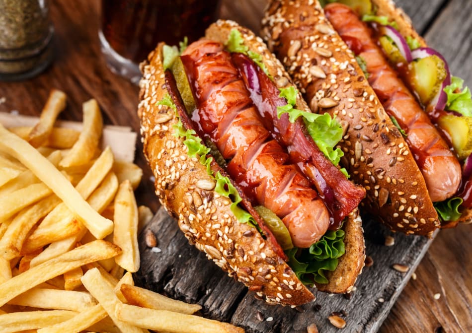 Barbecue grilled hot dogs with french fries.