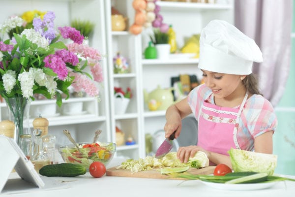 Girl cooking for her mother on mother's day