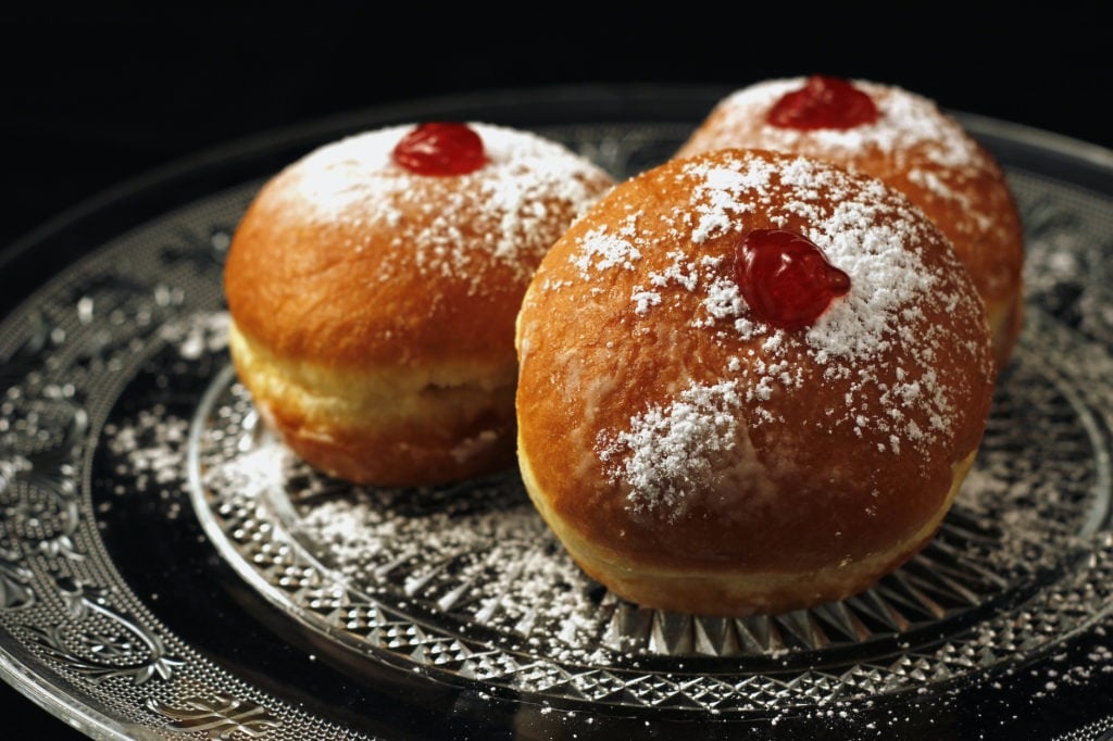 Traditional Jewish food for Chanukkah holyday, luxurious looking sufganiyot.