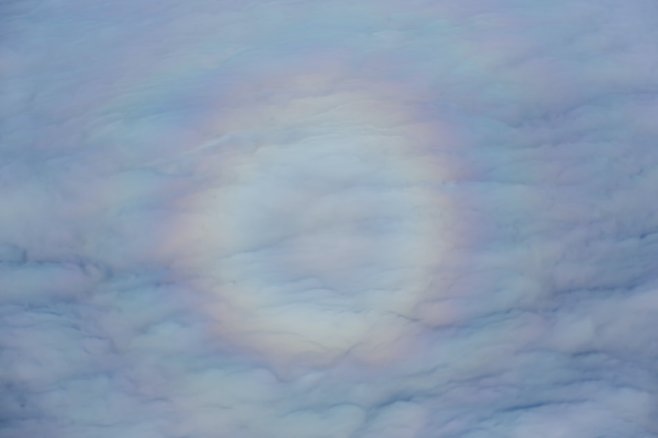 A circle of light rainbow in the clouds.