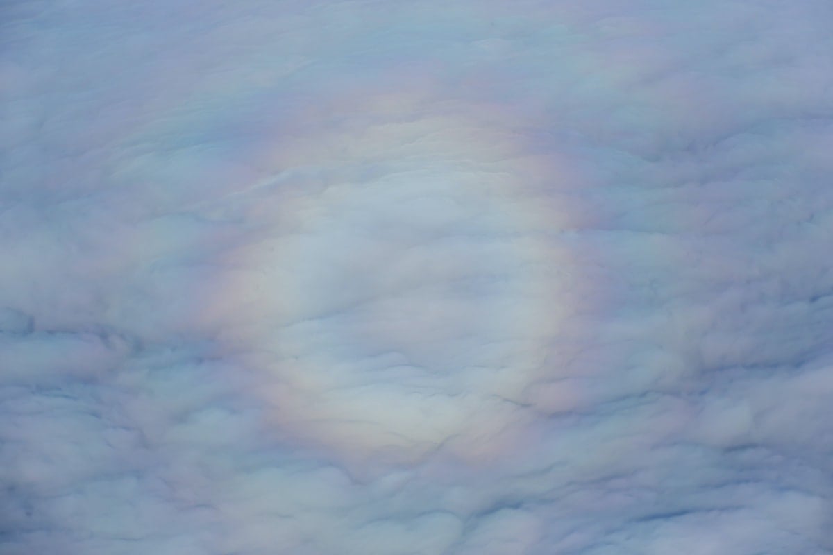 A circle of light rainbow in the clouds.