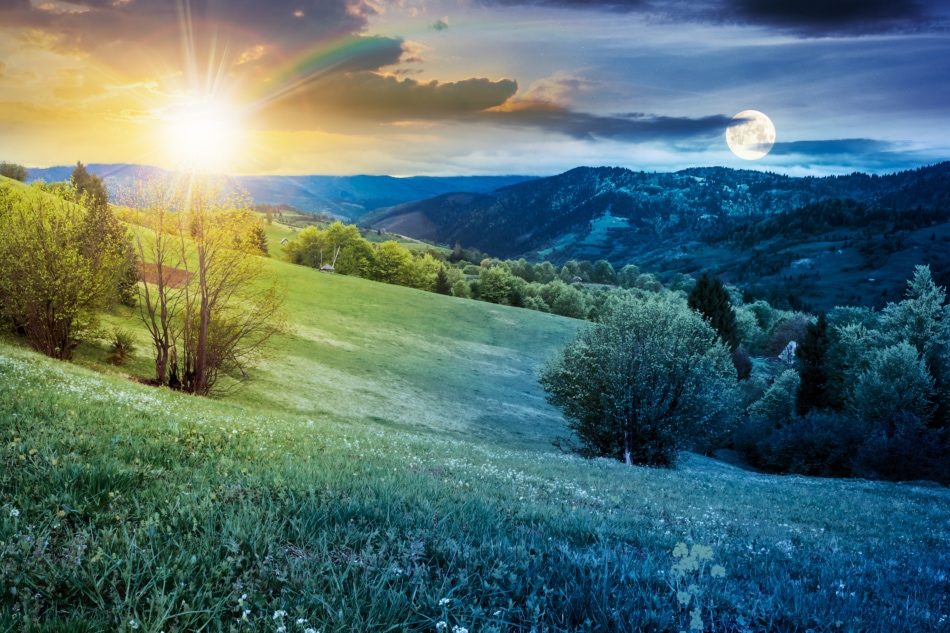 Spring equinox above rural landscape in mountains. 