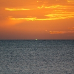 green flash at sunset along the ocean