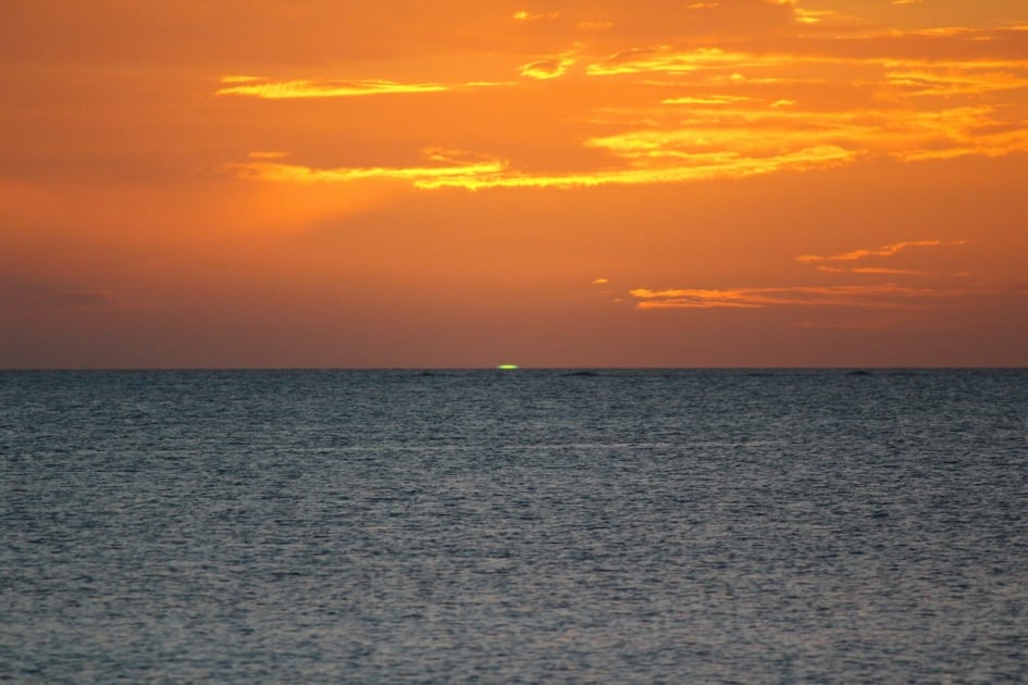 green flash at sunset along the ocean