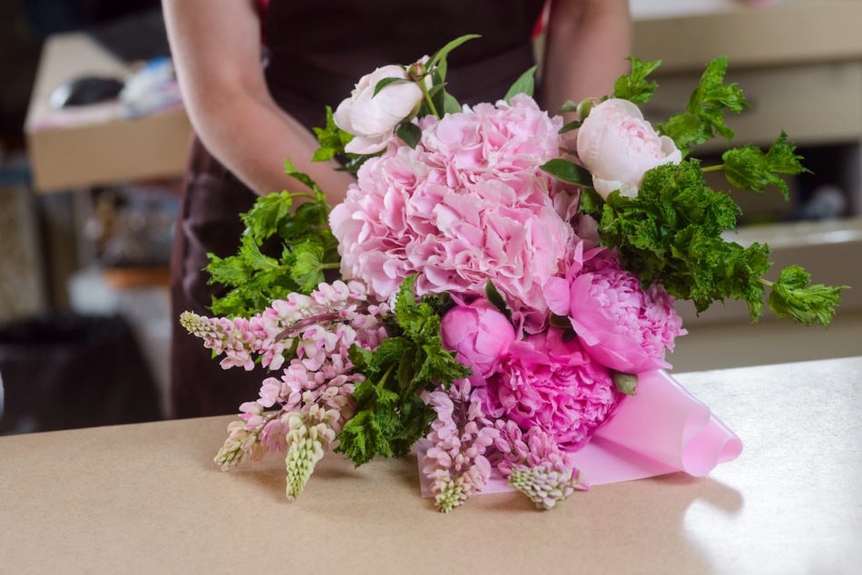 Florist arranging flowers for bouquet