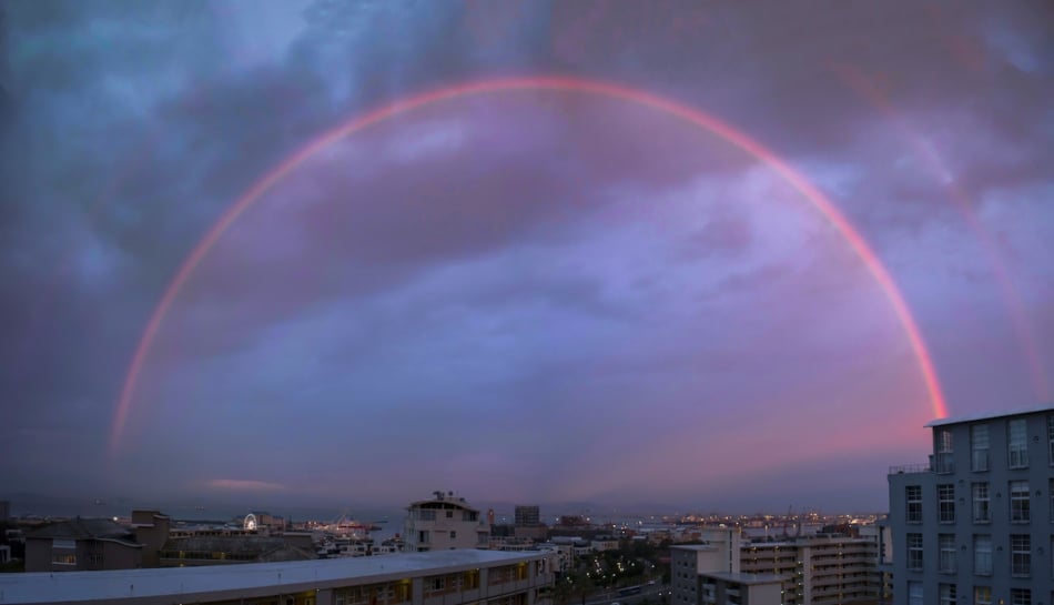 Monochrome red rainbow at sunset.