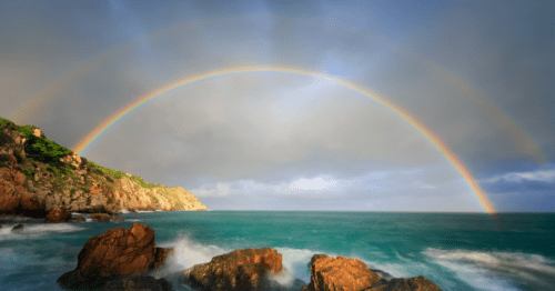rainbow against the ocean