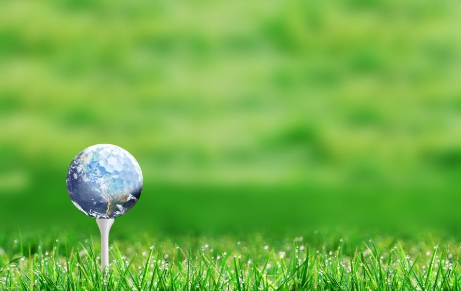 Golf tee with Earth balanced on top