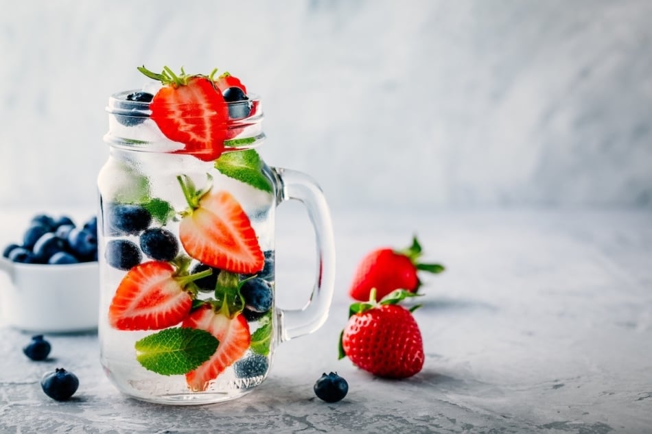 Strawberry tops infused water with berries and mint